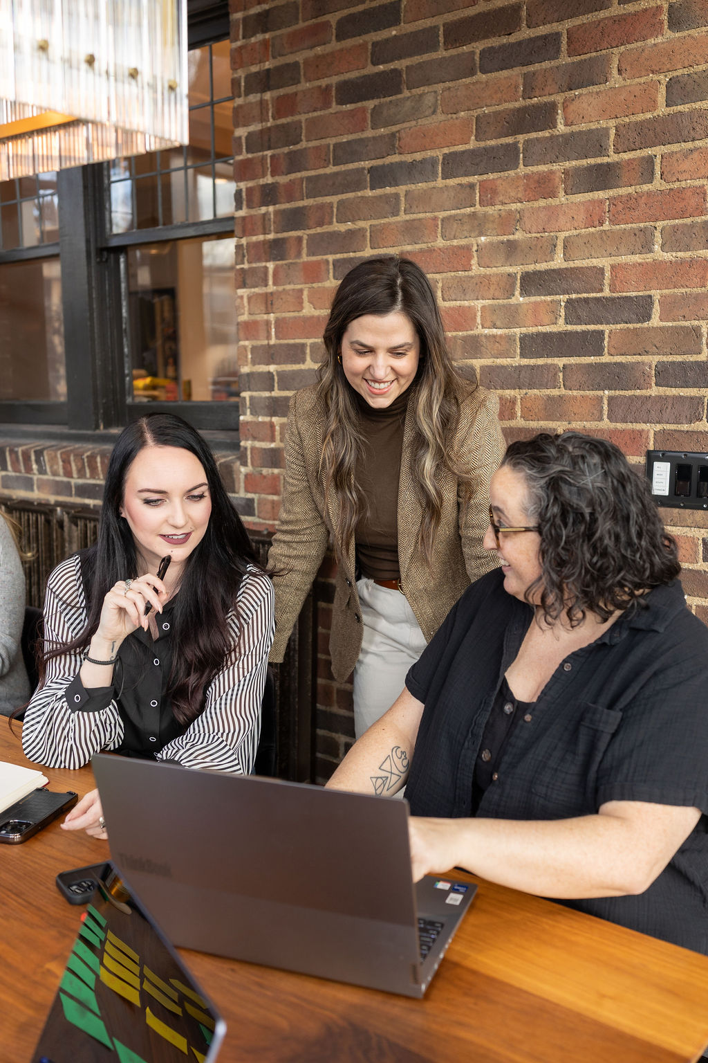 Three Women Auditing their Company's Marketing